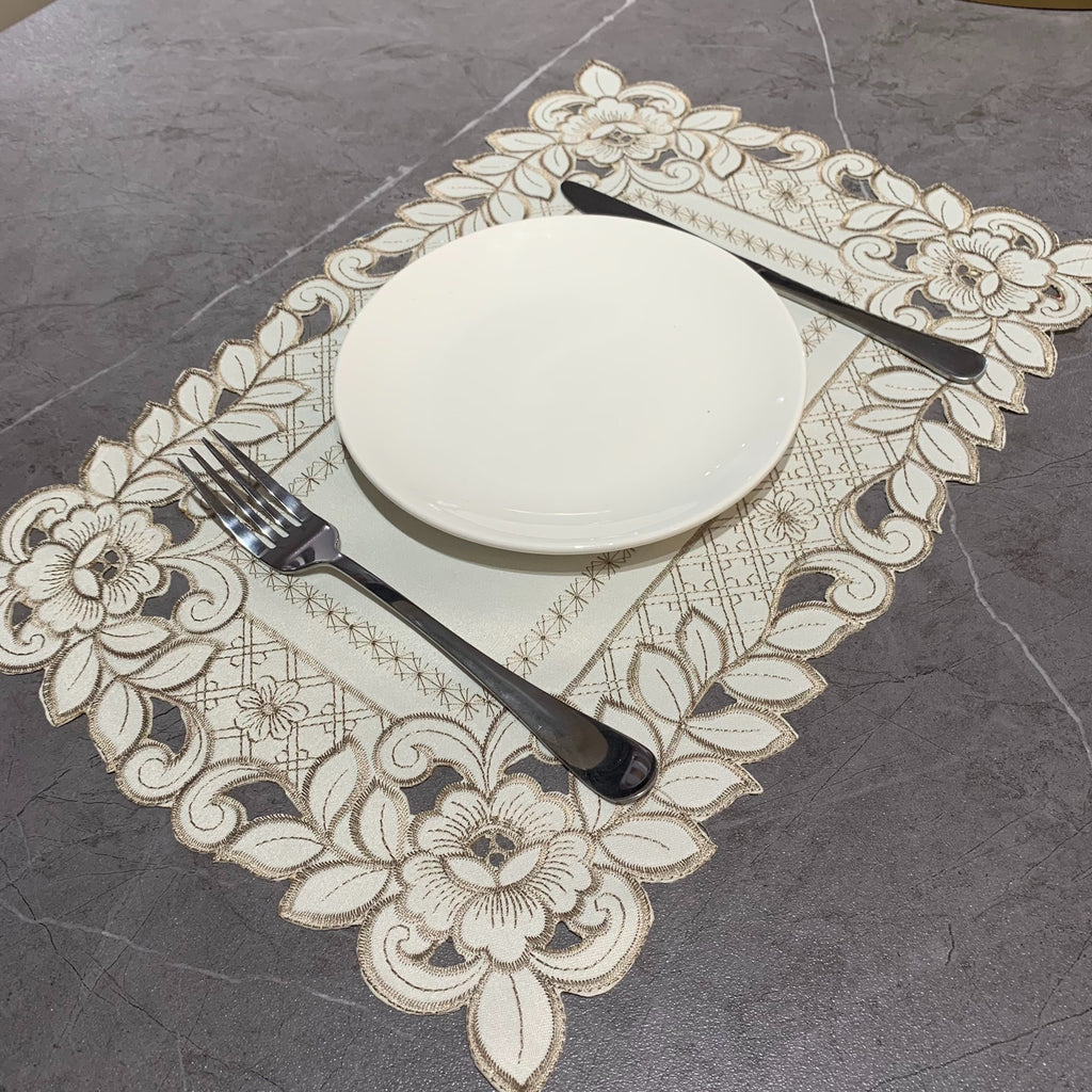 Embroidered cutwork placemat with floral border