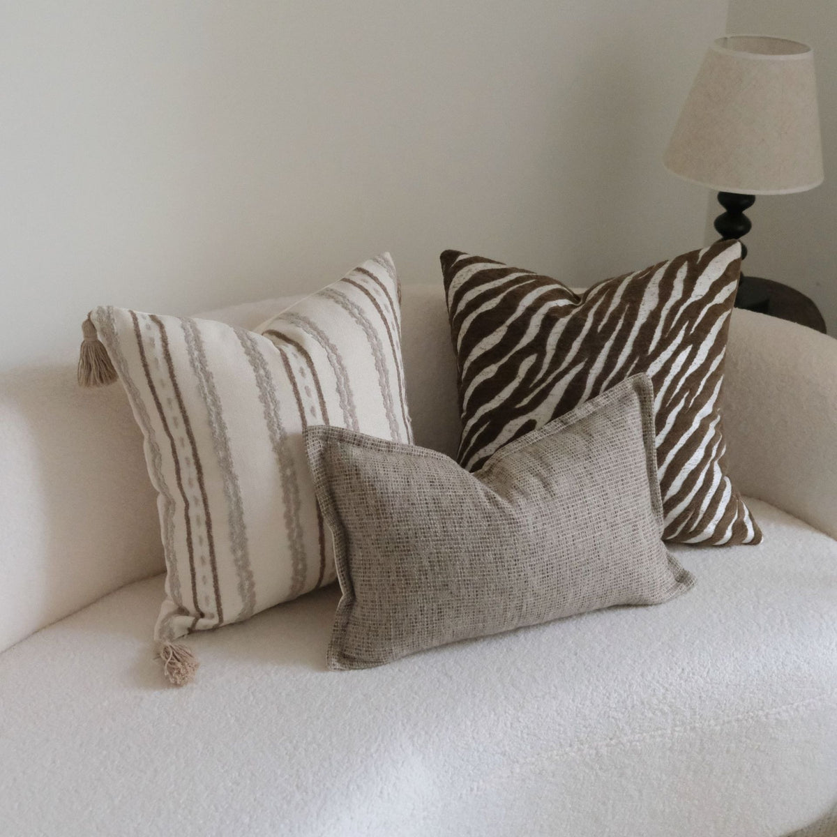 Caramel wabi-sabi textured cushion on a sofa