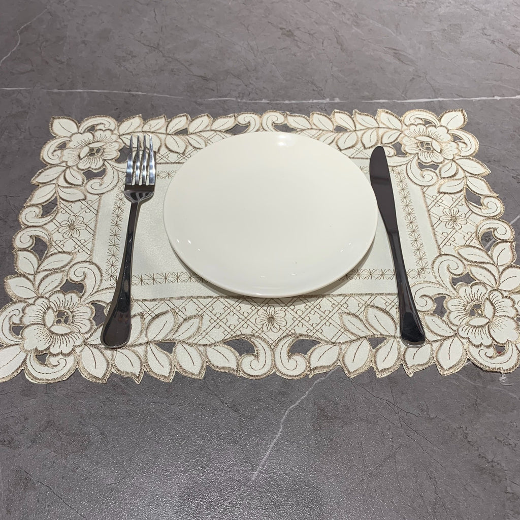 Embroidered cutwork placemat with floral border