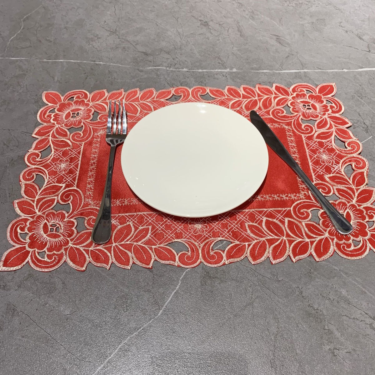 Embroidered cutwork placemat with floral border