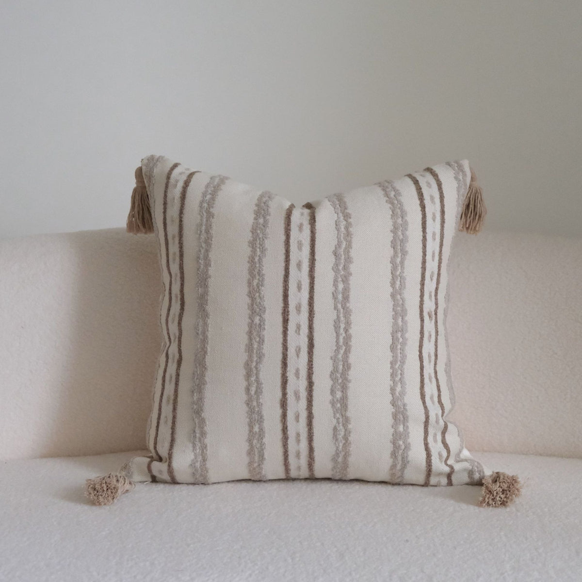 Caramel wabi-sabi textured cushion on a sofa