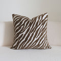 Caramel wabi-sabi textured cushion on a sofa