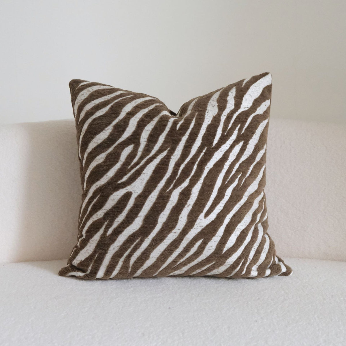 Caramel wabi-sabi textured cushion on a sofa