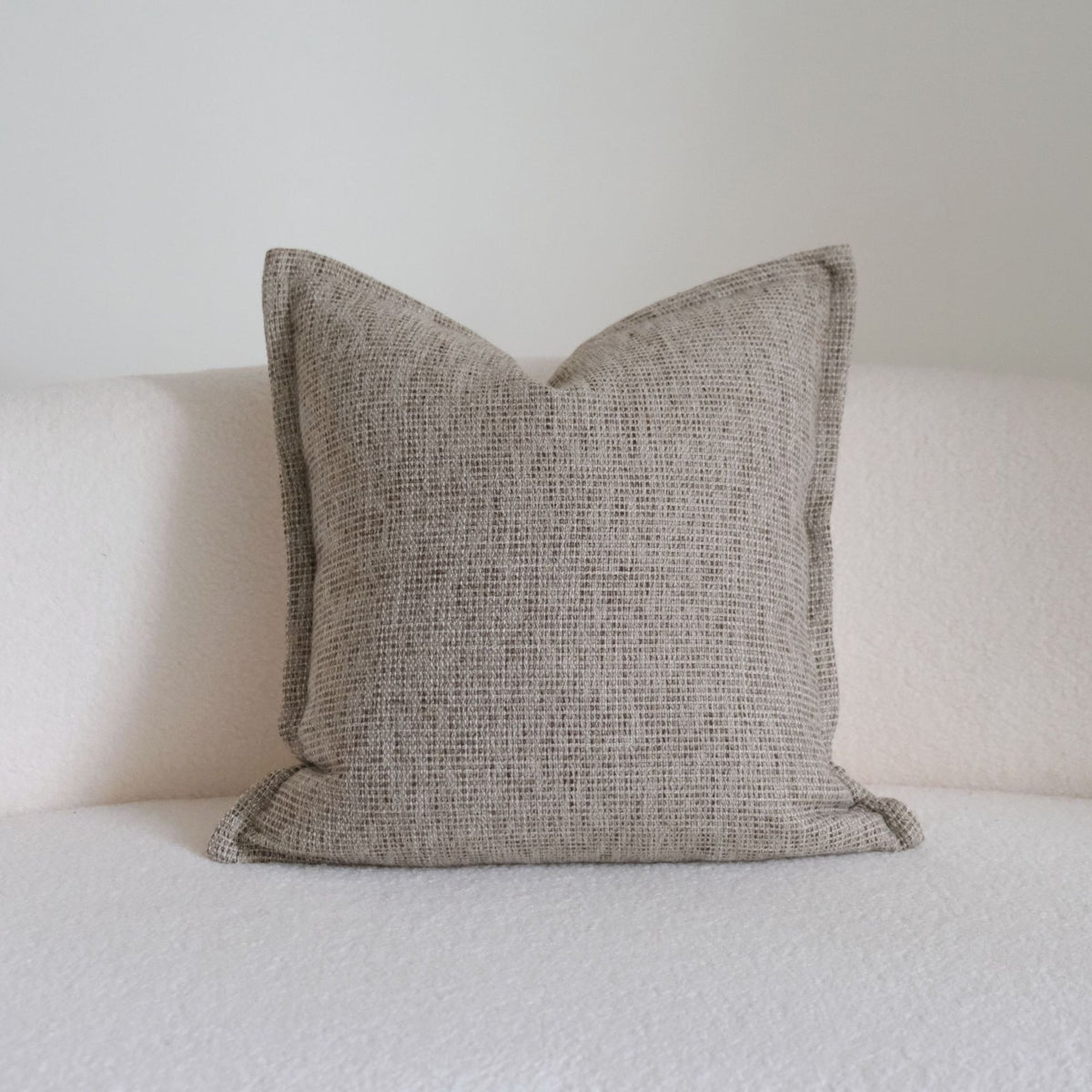 Caramel wabi-sabi textured cushion on a sofa